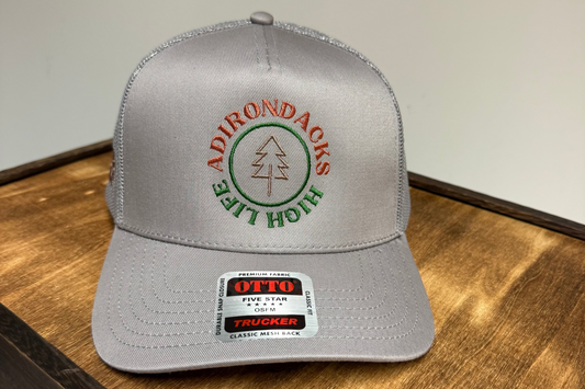 Gray cap with Adirondacks logo on a wooden surface
